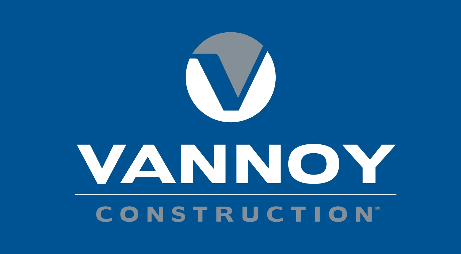 Vannoy Logos_Blue BG Vannoy Construction logo with a stylized “V” inside a circle above the company name on a blue background.
